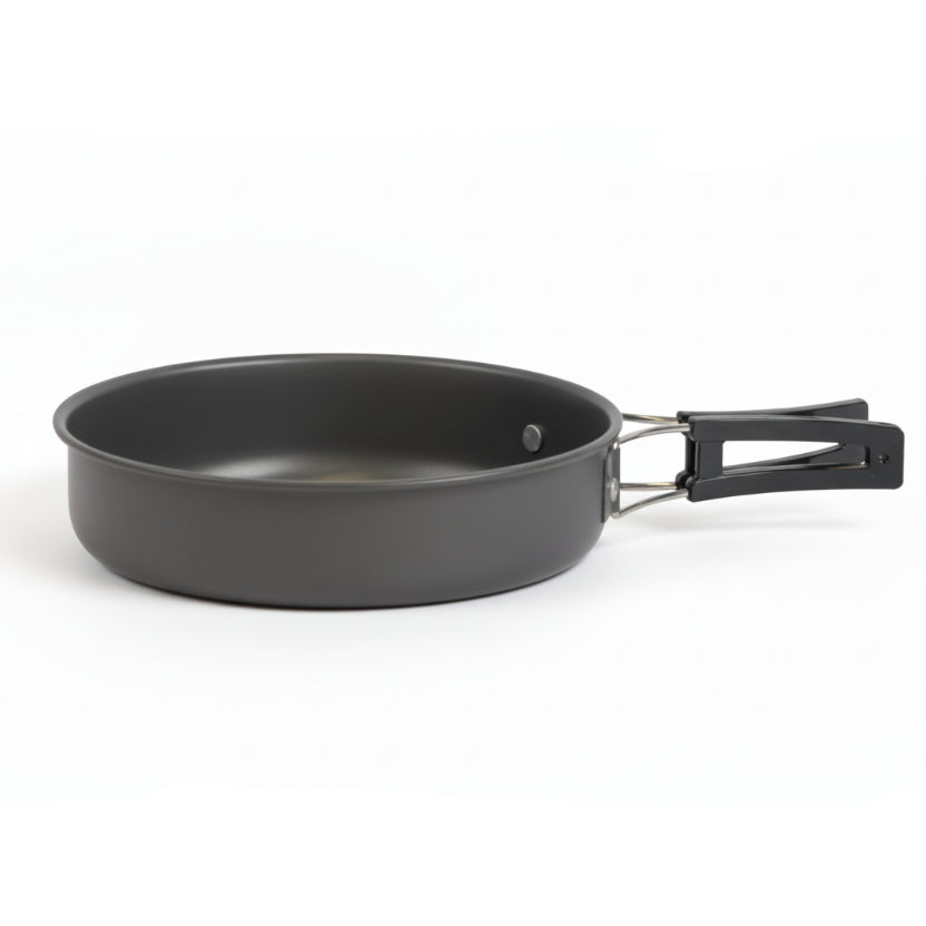 Black frying pan with a handle on a white background