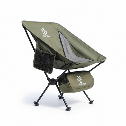 Green camping chair with carrying bag on a white background
